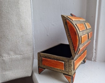 Treasure chest box: amazing brass trinket box with hand stained orange panel inlay, triangle motifs and a deep red velvet quilted lining