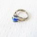 Unusual, sci-fi style stainless steel and bright blue marbled glass statement ring, adjustable