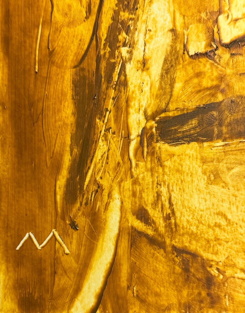 May include: Abstract art piece with a textured surface, featuring shades of gold and brown. The artwork has visible brushstrokes and a small, white, zig-zag shape near the bottom. The overall effect is a warm, earthy aesthetic.