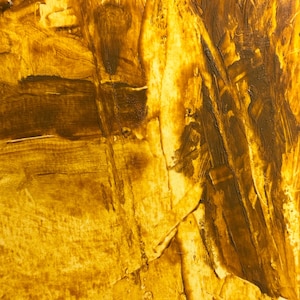 May include: Abstract artwork with a textured surface, featuring a palette of golden yellow and deep brown hues. The brushstrokes create a dynamic, layered effect, with visible ridges and valleys. The artwork evokes a sense of warmth and depth.