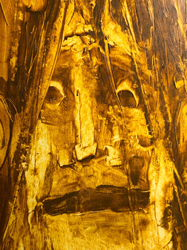 May include: Abstract painting with a textured surface, featuring a face-like composition in shades of brown and yellow. The artwork uses thick brushstrokes to create a sense of depth and movement, with the central focus resembling a human face.