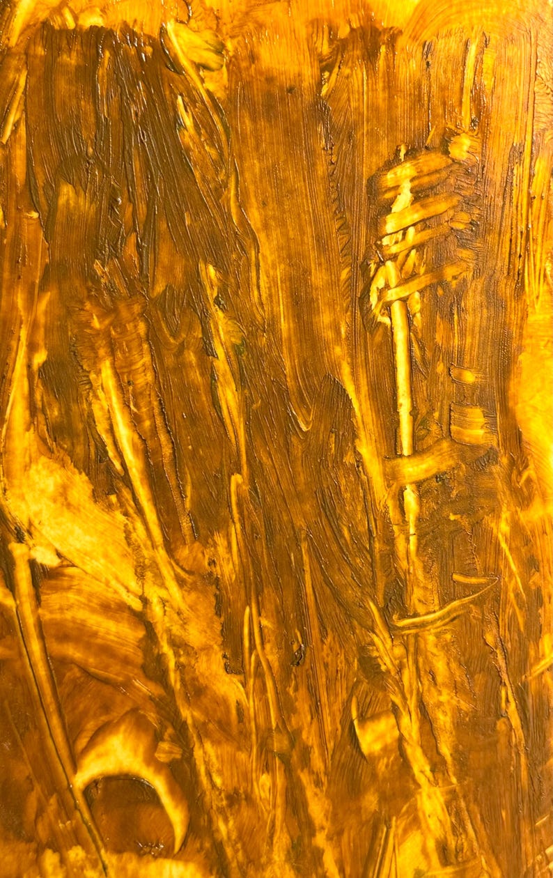 May include: Abstract artwork with a textured surface. The painting features a blend of golden yellow and brown hues, applied with visible brushstrokes. The composition has a vertical orientation, with a central, lighter-toned element.