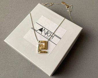 Gold Greek Key charm necklace on silver chain by Ankh By Racquel