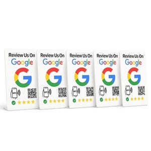 May include: Five white rectangular cards with the Google logo and the text "Review Us On Google." Each card has a QR code, NFC symbol, and five yellow stars. The Google logo is in red, yellow, green, and blue.