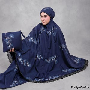 May include: A dark blue prayer garment set featuring a matching head covering and a rectangular pouch. The fabric is adorned with a white ginkgo leaf pattern and finished with a black lace trim along the edges. The text NindyaCrafts is visible.