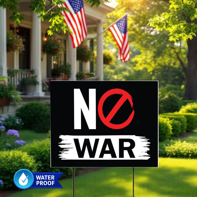 May include: A black sign with the words "NO WAR" in white, with a red circle and slash through the "O". The sign is in a yard with American flags and a house in the background. The sign is water proof.
