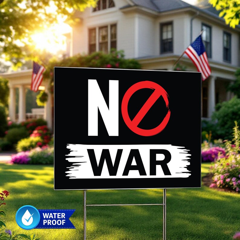 May include: Black yard sign with the words "NO WAR" in white, with a red circle and slash through the "O". The sign is on a metal stake in a grassy yard, with a house and American flags in the background. The sign is water proof.