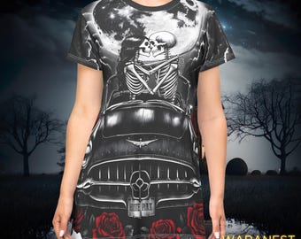 May include: Black and white graphic dress featuring a skeleton couple embracing in a classic car under a full moon. The dress has red roses at the hem and the text "ROUTE PINK" on the car's license plate. The dress is a unique gothic design.
