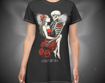 May include: Black t-shirt dress with a graphic print of a skeleton holding a woman in a red dress. The graphic includes red roses and the text "I'm crazy about you".