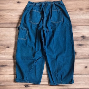 Vintage style baggy wide leg skater fit jeans in washed mid blue. All sizes.