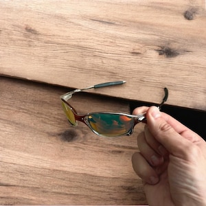 Insane metal frame sunglasses in silver with orange lense. One size.