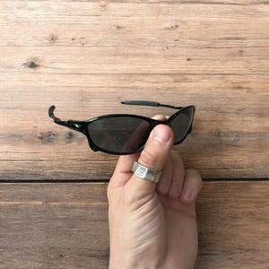 Insane metal frame sunglasses in black with black lense. One size.