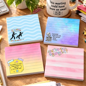 May include: Four square sticky note pads with unique designs. One has blue waves and a stick figure graphic, one has a blue-purple watercolor gradient with lines and a skeleton, one has a pink-yellow gradient with lines and a yellow note graphic, and one has pink stripes with the text "BUT DID YOU DOCUMENT IT?"