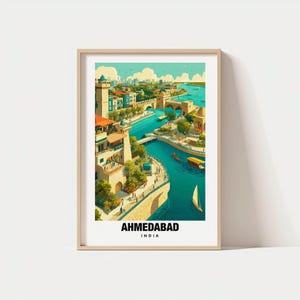 May include: A framed art print featuring a vibrant illustration of Ahmedabad, India. The artwork depicts a river scene with buildings, bridges, and boats under a blue sky. The city's name is printed in bold letters at the bottom.