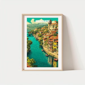 May include: Framed art print of Amarante, Portugal. The image depicts a vibrant river scene with a bridge, buildings with red tile roofs, and the text "AMARANTE PORTUGAL". The artwork is set in a wooden frame.
