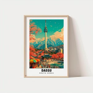 May include: A framed art print featuring a colorful illustration of Daegu, South Korea. The image showcases the Daegu Tower, surrounded by vibrant red trees, mountains, and a bustling cityscape. The text "DAEGU SOUTH KOREA" is displayed at the bottom.