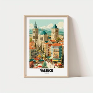 Puede incluir: Una impresión artística enmarcada con una ilustración en acuarela de Valence, Francia. La obra representa un paisaje urbano con una gran catedral, edificios con tejados naranjas y el texto "VALENCE FRANCE" en la parte inferior.