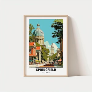 Puede incluir: Una impresión artística enmarcada que presenta una escena callejera en Springfield, Illinois. La obra de arte representa un edificio con cúpula, edificios de ladrillo rojo y árboles verdes bajo un cielo azul. El texto "SPRINGFIELD ILLINOIS" se muestra en la parte inferior.