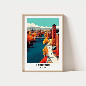 May include: Framed art print featuring a vibrant illustration of Lewiston, Maine. The artwork depicts a river scene with a bridge, buildings, and colorful autumn foliage. The text "LEWISTON MAINE" is displayed at the bottom of the print.