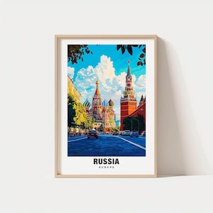 May include: A framed art print featuring a vibrant street scene in Russia. The image showcases colorful buildings, including a cathedral with onion domes and a tall clock tower, under a bright blue sky. The word "RUSSIA" is printed at the bottom.