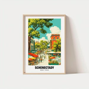 May include: A framed art print featuring a colorful illustration of Schenectady, New York. The artwork depicts a bustling street scene with shops, trees, and people. The text "SCHENECTADY NEW YORK" is printed at the bottom.