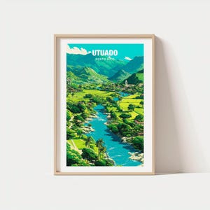May include: Framed art print featuring a vibrant landscape of Utuado, Puerto Rico. The artwork depicts a river winding through lush green valleys and mountains under a bright blue sky. The word "UTUADO" is displayed at the top of the print.