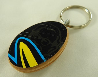 Keychain made from a recycled skateboard deck