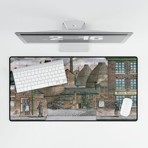 May include: A computer setup featuring a white keyboard, mouse, and a large mousepad with a detailed illustration of a historic town scene. The mousepad has the text "BONE CHINA" on the building.