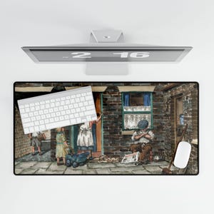May include: Rectangular mouse pad featuring a watercolor painting of a street scene with figures, a brick building, and a seated man reading a newspaper. A white keyboard and mouse are on the pad.
