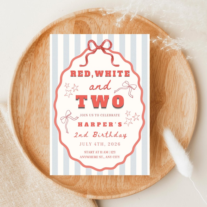 May include: A birthday invitation with a red, white, and blue theme. The text reads "RED, WHITE and TWO" with the name "HARPER'S" and the date "JULY 4TH, 2026". The invitation has a striped background and is on a wooden tray.
