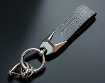 Mercedes Benz AMG key fob in black leather with AMG logo.