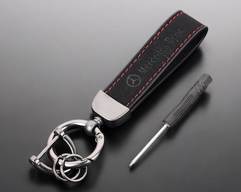 Mercedes Benz key fob in black with red stitching and Mercedes Benz logo