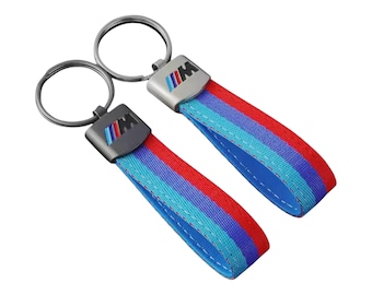 BMW M key fob with BMW M logo featuring the typical BMW M colors.