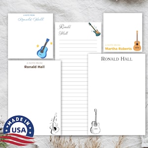 May include: Four blank note cards with a guitar design and the text "A note from Ronald Hall" and "A note from Martha Roberts".