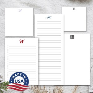 May include: Four different styles of personalized stationery with lined paper. The stationery is white with a variety of monogram styles in blue, red, and black. The stationery is made in the USA.