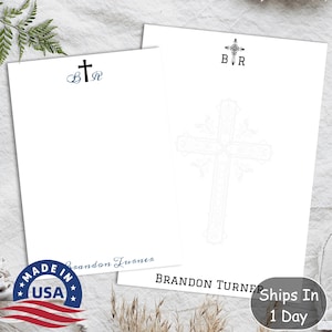 May include: White notepad with a black cross and the initials "B.R." printed on the top. The notepad has a decorative cross design on the back and the text "BRANDON TURNER" printed at the bottom.