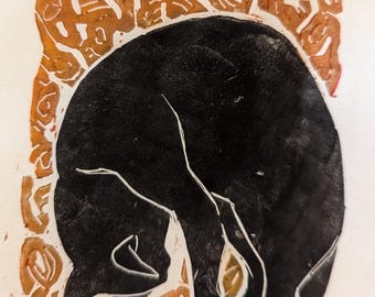 May include: Black and white linocut print of a cat curled up on a background of orange swirls.