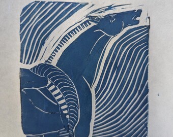 May include: A blue and white linocut print of a horse's head and neck. The horse is facing to the right and has a long mane. The background is a series of diagonal lines.