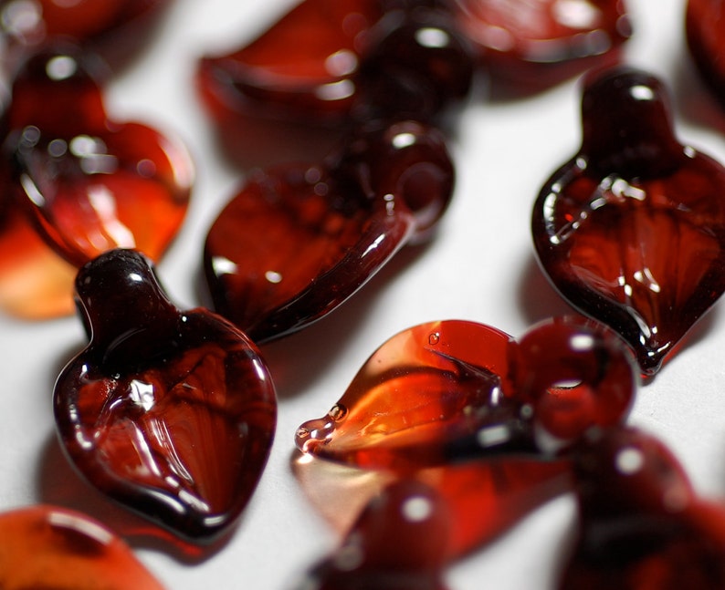 handmade lampwork glass beads boro leaf shape beads in deep garnet and jasper reds set of 15 handmade beads by Paulbead