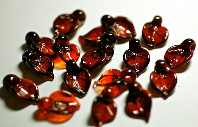 handmade lampwork glass beads boro leaf shape beads in deep garnet and jasper reds set of 15 handmade beads by Paulbead
