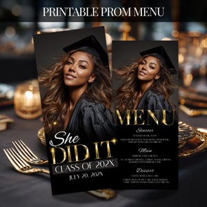 May include: Printable prom menu featuring a graduate in a black cap and gown. The menu has a black background with gold text that reads "MENU" and "She DID IT CLASS OF 202X JULY 20, 202X". The menu includes starter, main, and dessert options.