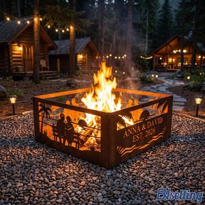 May include: A square metal fire pit with a rusted finish featuring cut-out silhouettes of palm trees, a sunset, and two people sitting on a bench. The side panel displays the text ANNA & DAVID EST. 2026. A bright fire burns inside the structure.