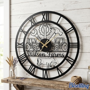May include: Black metal wall clock with Roman numerals, featuring a farm theme. The clock includes tractor and cow silhouettes, tools, and the text "Wilson Farms". The clock hands are gold.