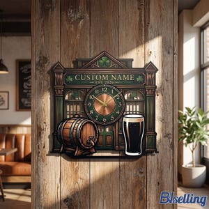 May include: A wall clock shaped like a pub storefront with a green and brown colour scheme. It features a central clock face, a wooden barrel, and a glass of dark stout. The text reads CUSTOM NAME and EST. 2026, accented with green shamrock icons.