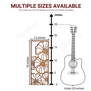 a guitar and a decorative panel with floral designs, along with a scale indicating the sizes of the guitar and the panel.