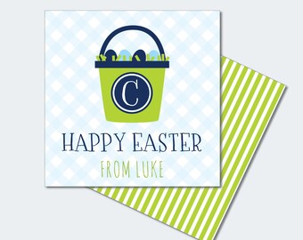 May include: Square Easter gift tag with a green bucket holding Easter eggs, a blue handle, and the letter "C". The tag reads "HAPPY EASTER FROM LUKE" on a blue and white checkered background. The back has green and white stripes.