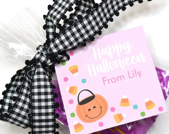 May include: Pink Halloween treat bag with a black and white checkered ribbon. The tag says "Happy Halloween From Lily" with a pumpkin and candy corn design.