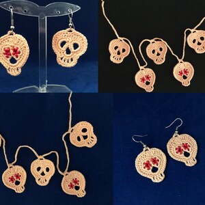 May include: A set of crocheted skull earrings and a crocheted skull garland. The skulls are a light pink color with red flower accents.