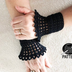 May include: A pair of black crocheted wrist warmers with a lacy design. The wrist warmers are shown on a person's arms. The image also includes a ball of yarn and a crochet hook with the word "PATTERN" below it.