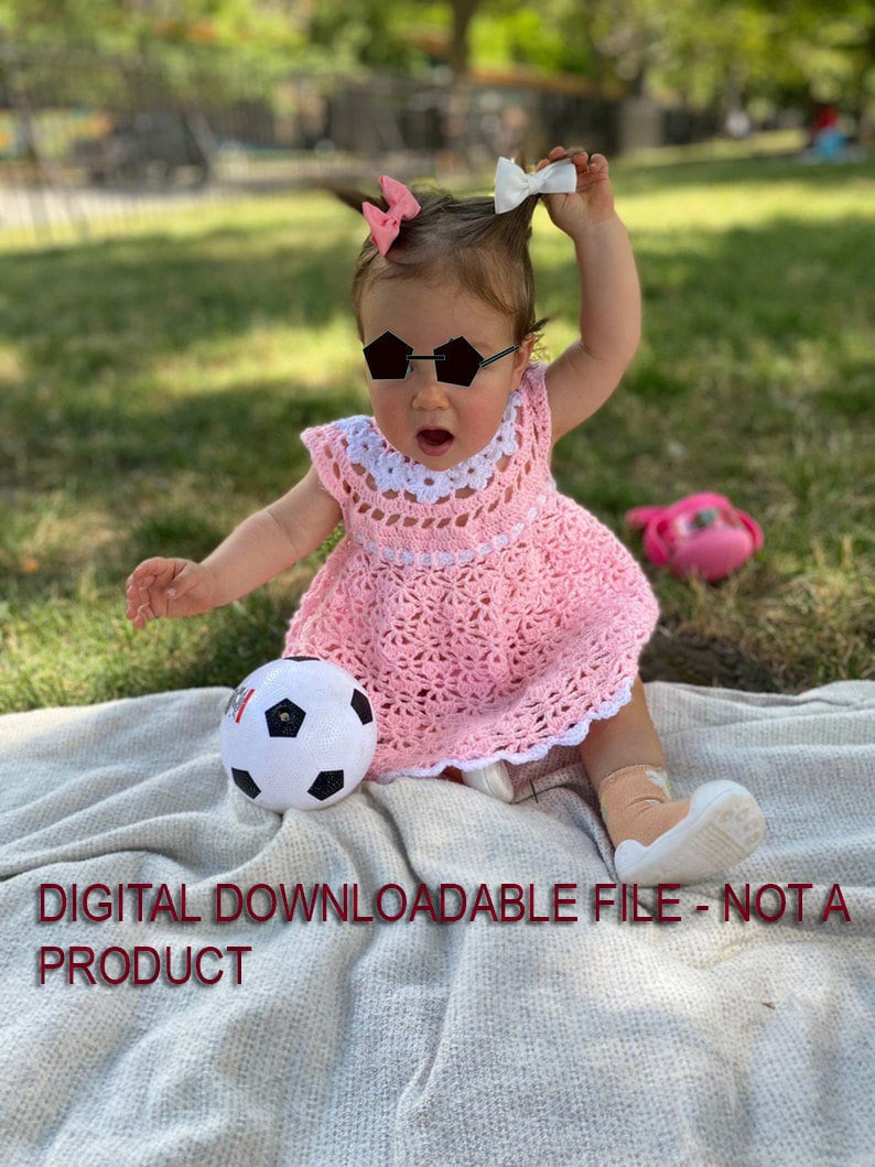 May include: A baby girl wearing a pink crocheted dress, black sunglasses, and a white bow in her hair. She is sitting on a white blanket with a soccer ball in front of her. The text "DIGITAL DOWNLOADABLE FILE - NOT A PRODUCT" is at the bottom of the image.